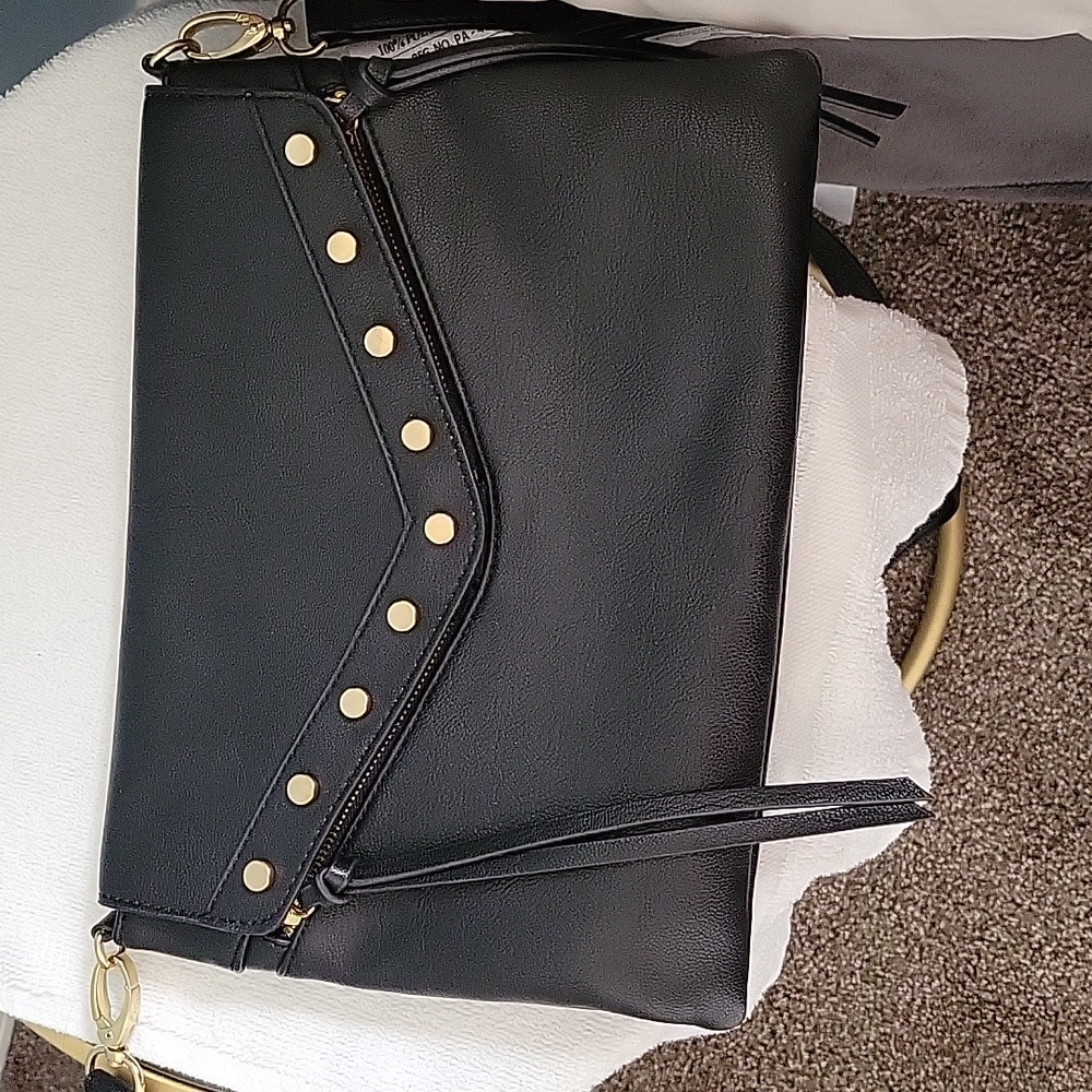 Crossbody bag worn a couple of times. Like new. 11 width 9 length black.